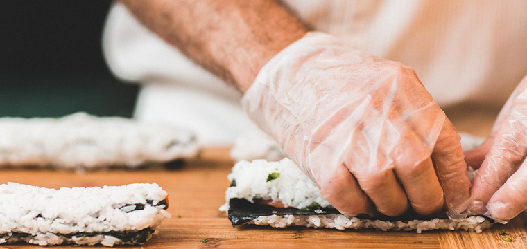 preparing sushi roll